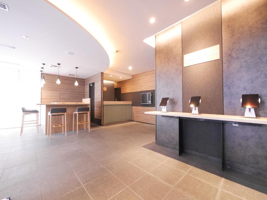 Kuchyň nebo kuchyňský kout v ubytování Hotel Comfybed Ginza