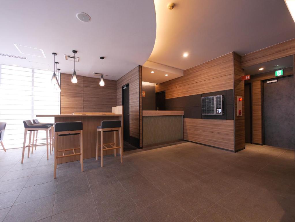 Kuchyň nebo kuchyňský kout v ubytování Hotel Comfybed Ginza
