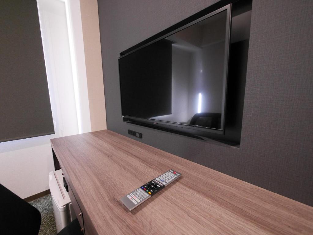 TV a/nebo společenská místnost v ubytování Hotel Comfybed Ginza
