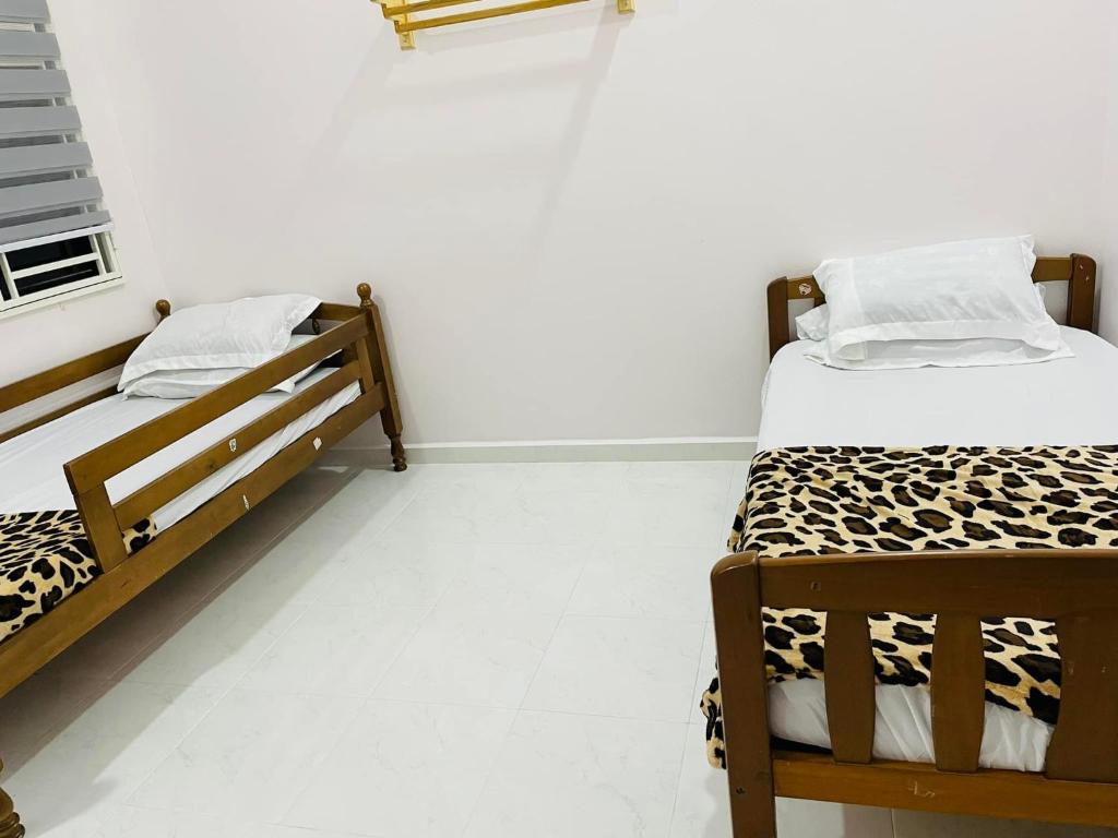 Postel nebo postele na pokoji v ubytování ADDA Guest House