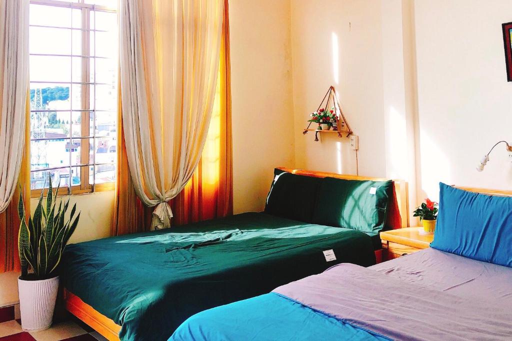 Postel nebo postele na pokoji v ubytování Nụ Cười Xinh