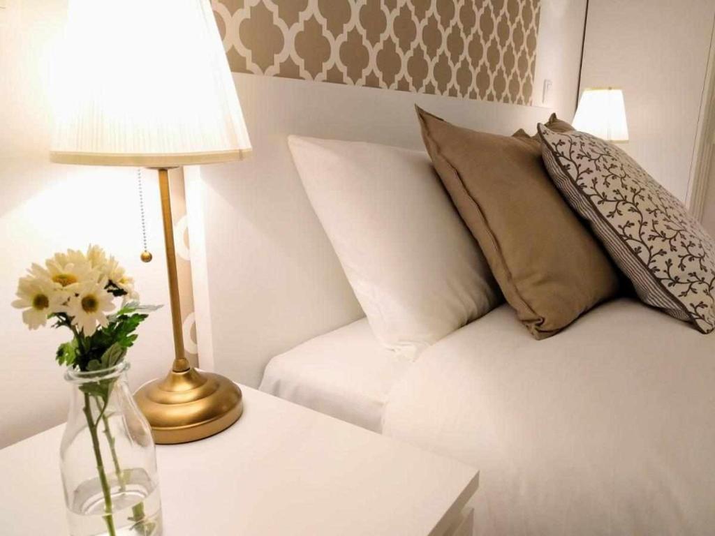 Postel nebo postele na pokoji v ubytování Sé Guesthouse