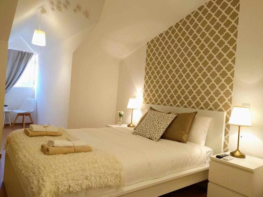 Postel nebo postele na pokoji v ubytování Sé Guesthouse