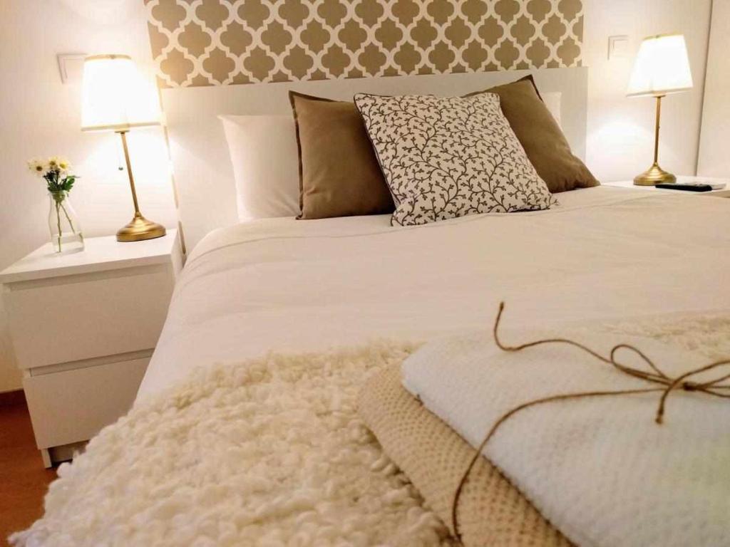 Postel nebo postele na pokoji v ubytování Sé Guesthouse