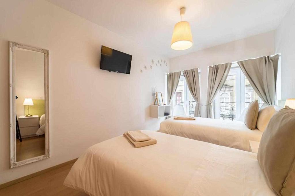 Postel nebo postele na pokoji v ubytování Sé Guesthouse