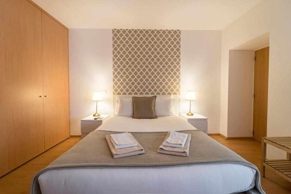 Postel nebo postele na pokoji v ubytování Sé Guesthouse