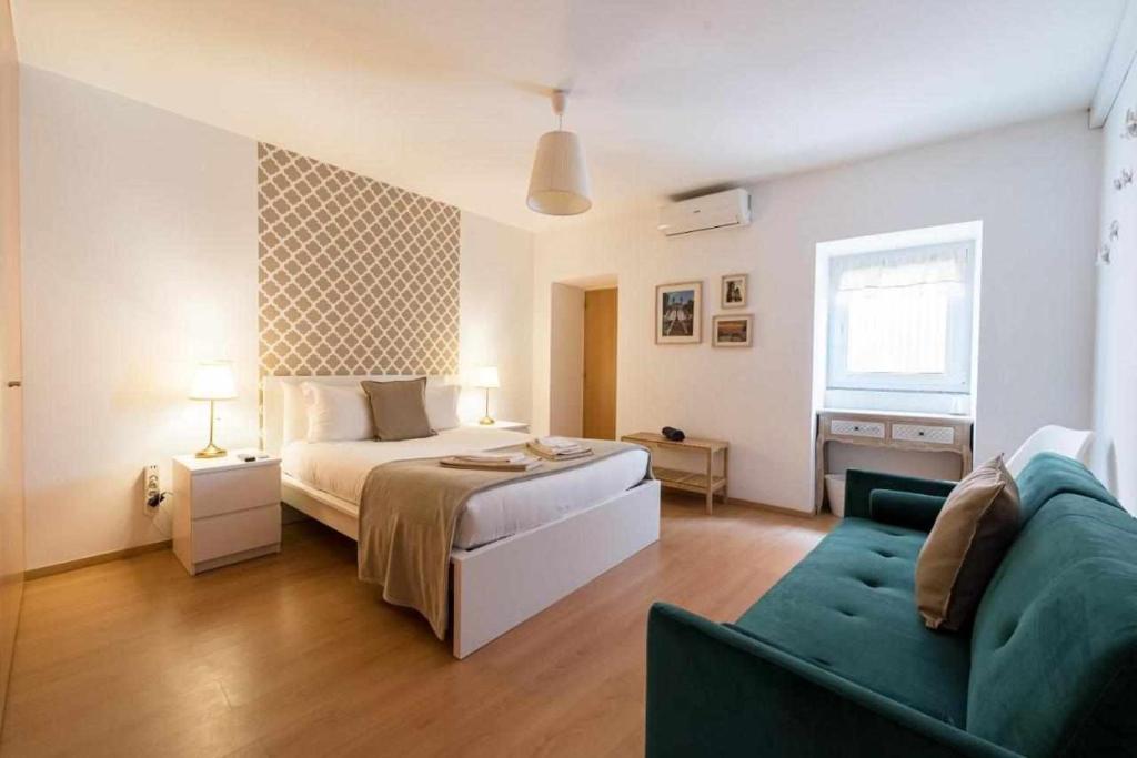 Postel nebo postele na pokoji v ubytování Sé Guesthouse