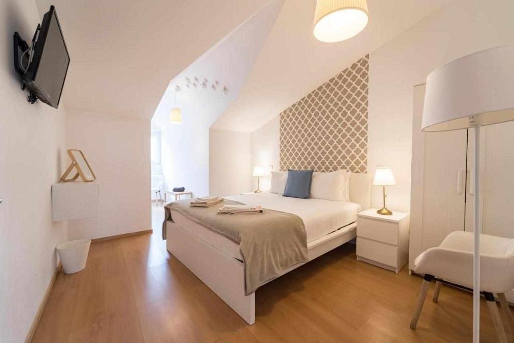 Postel nebo postele na pokoji v ubytování Sé Guesthouse