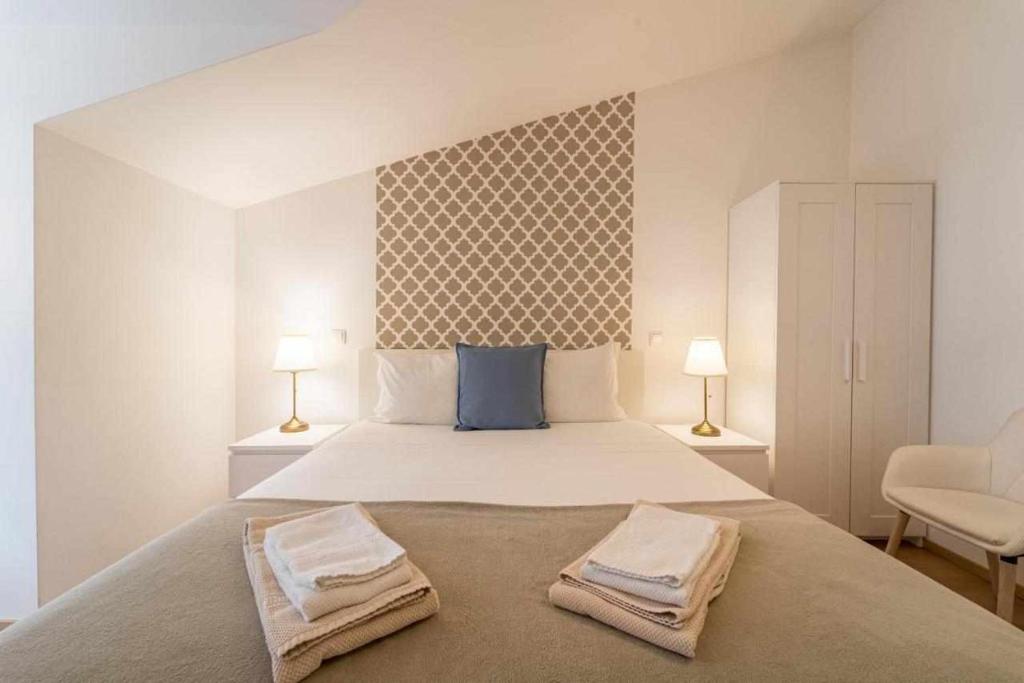 Postel nebo postele na pokoji v ubytování Sé Guesthouse