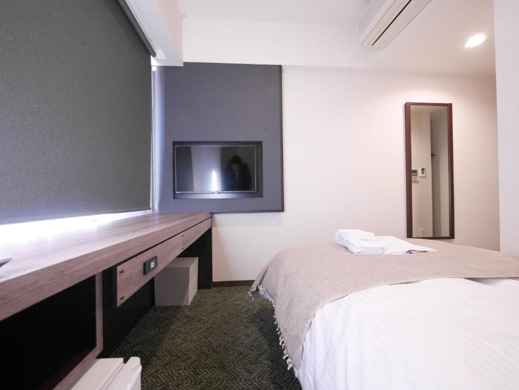 Postel nebo postele na pokoji v ubytování Hotel Comfybed Ginza
