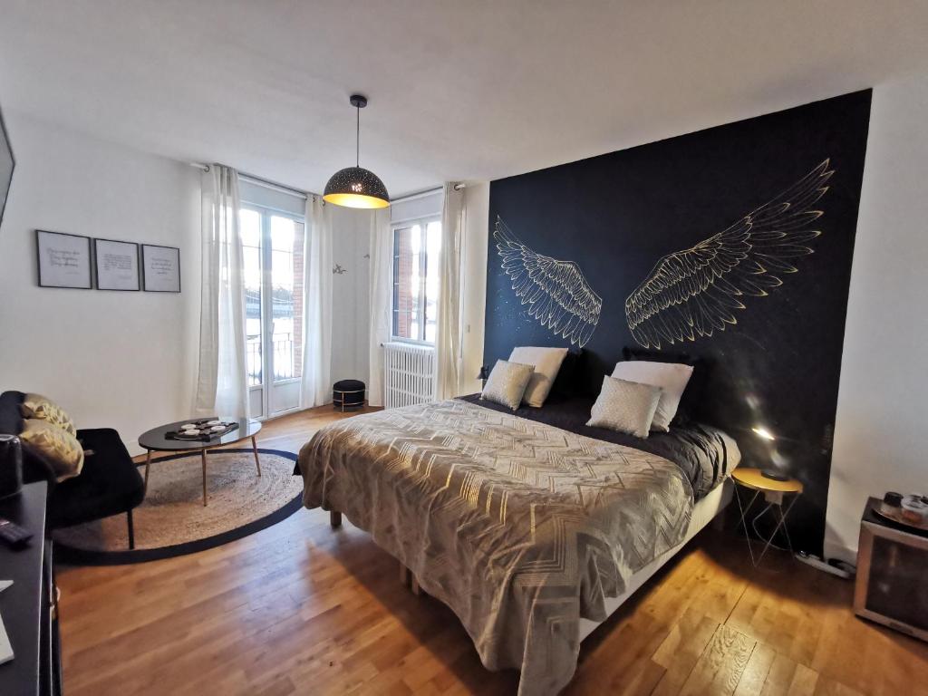 Postel nebo postele na pokoji v ubytování Les Rauches - Quai Loire - Suite Love