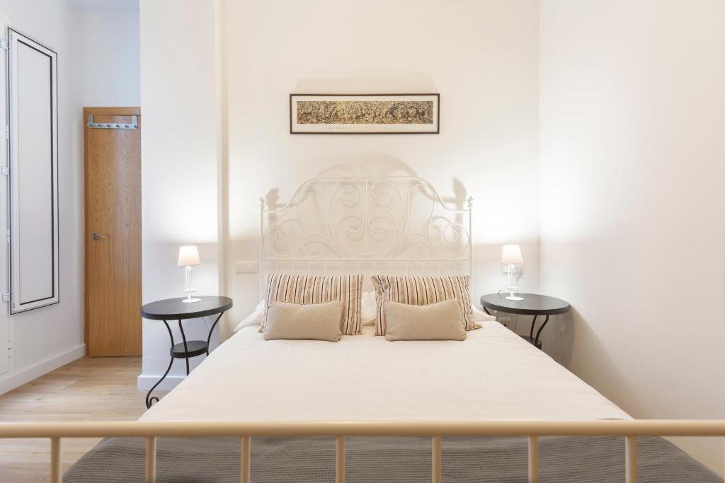 Кровать или кровати в номере Metropol Sevilla Urban