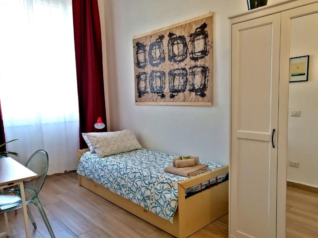 Llit o llits en una habitació de Casa Sansevera Lucca