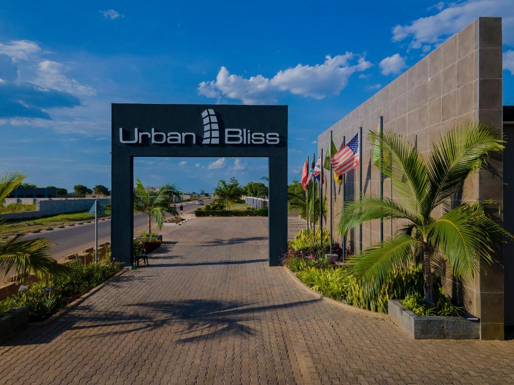 a sign for the entrance to a building at Urban Bliss Hotel in Kabwe