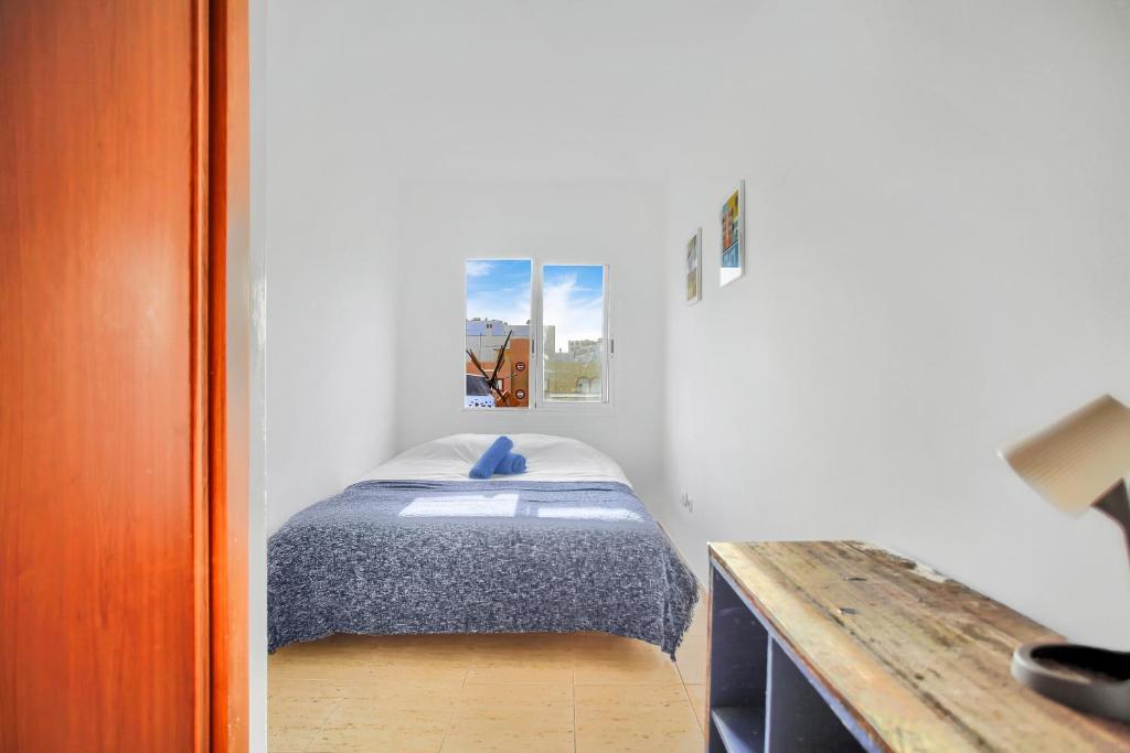 Postel nebo postele na pokoji v ubytování Cozy space in the heart of Corralejo
