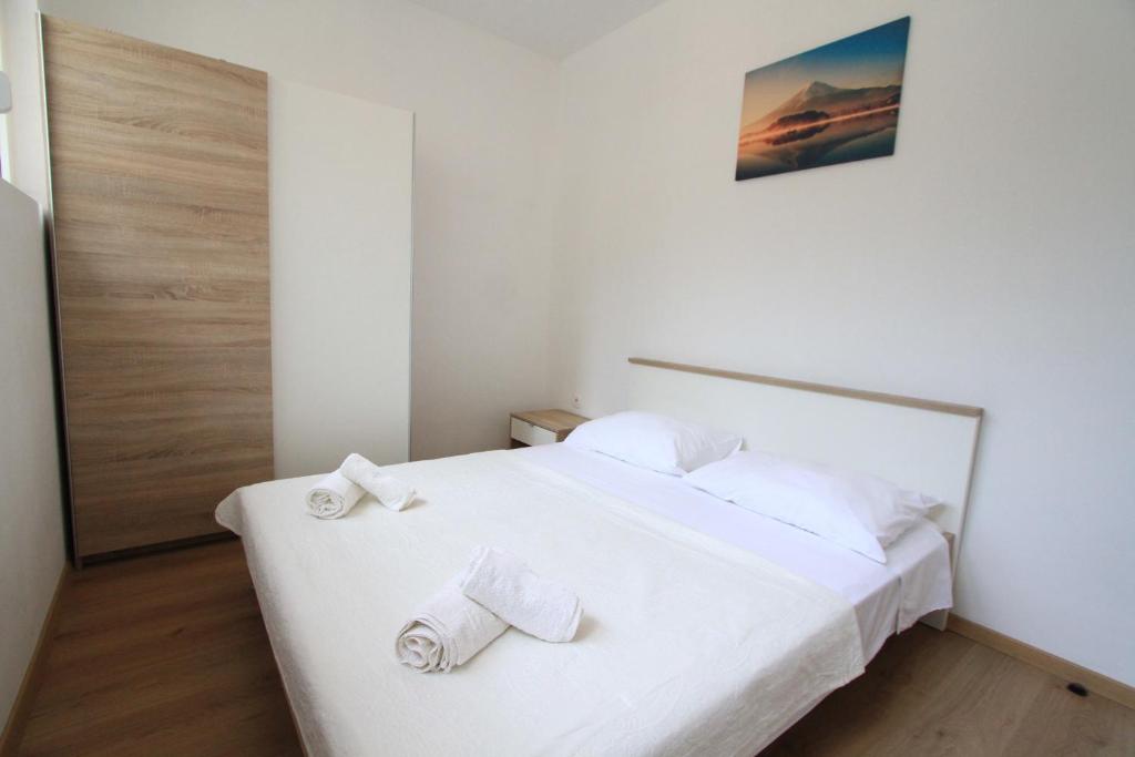Posteľ alebo postele v izbe v ubytovaní Apartman Darija