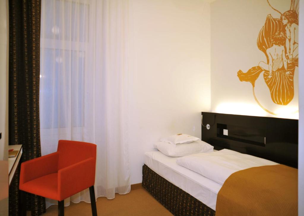 Postel nebo postele na pokoji v ubytování Alma Boutique-Hotel