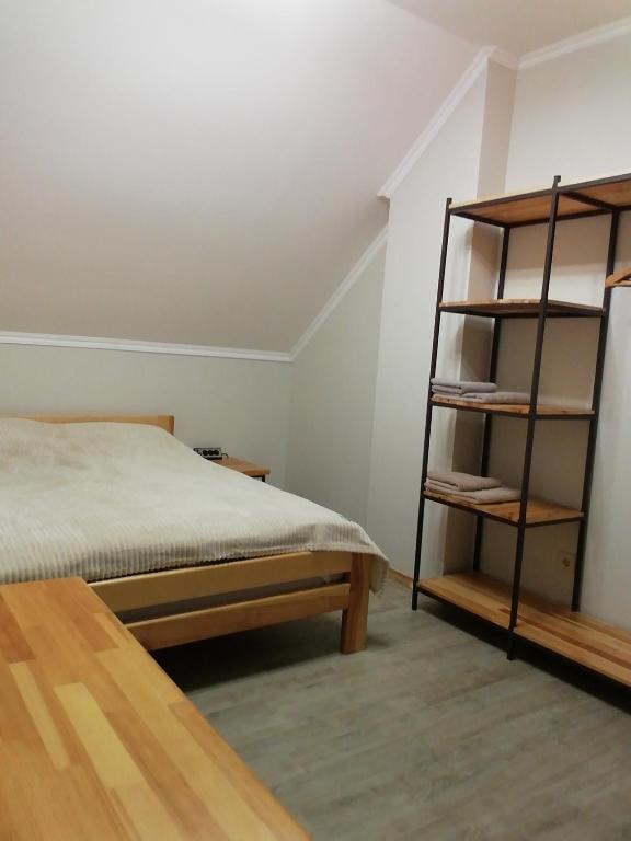 Postel nebo postele na pokoji v ubytování Пансіон АГАВА