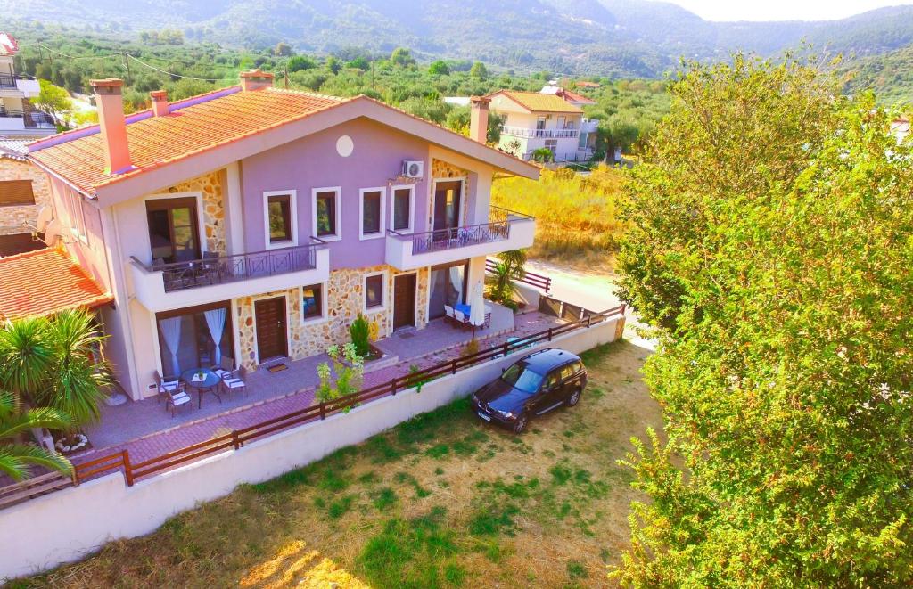 an aerial view of a house with a car parked in the yard at Ekavi Villa in Skala Potamias