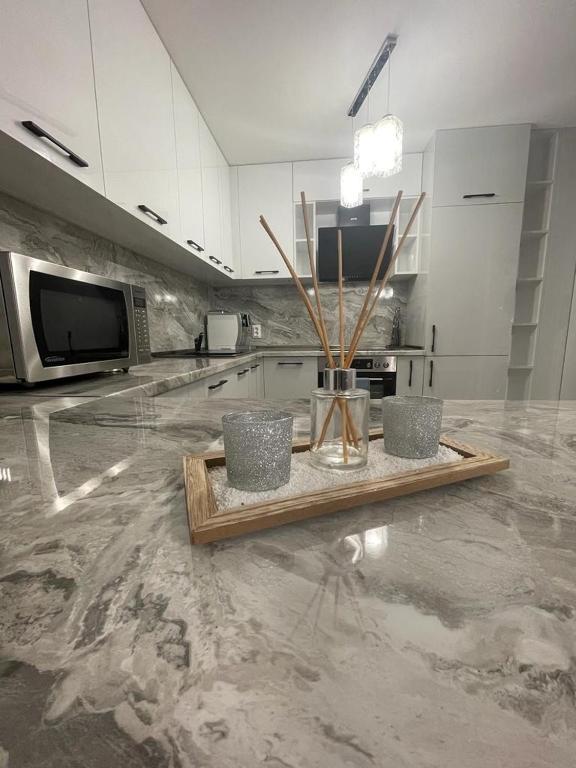 a kitchen with a counter with a table in it at Emily & Nasi in Plovdiv