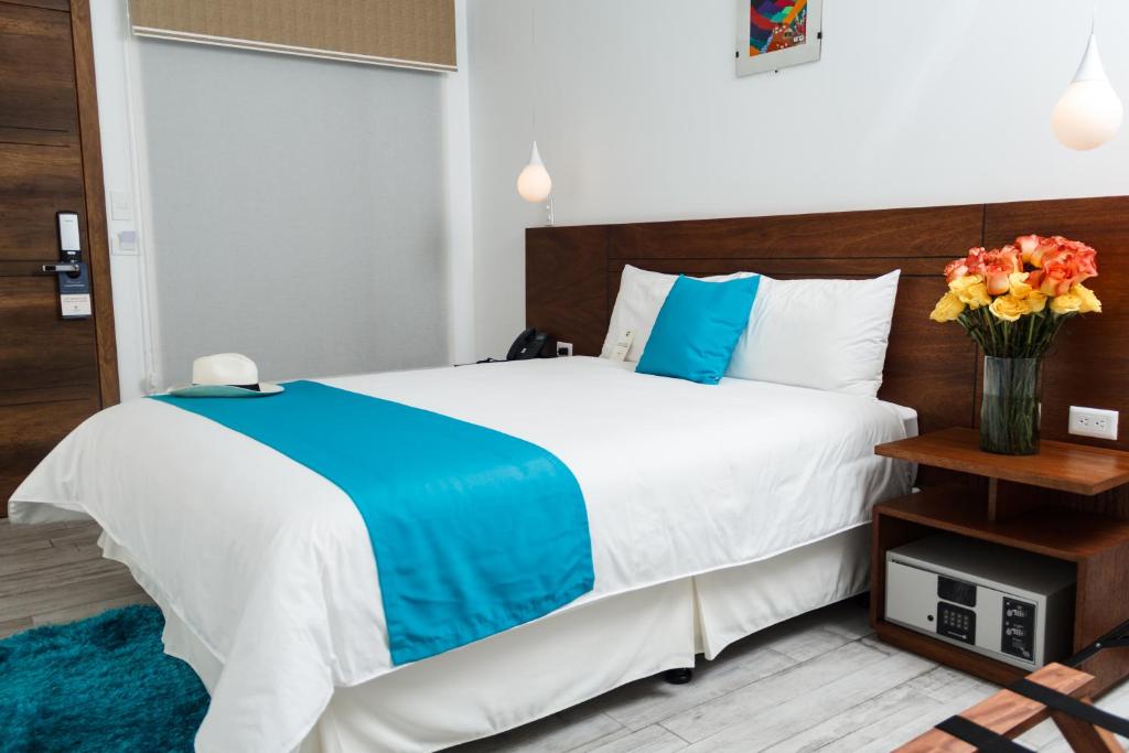 Postel nebo postele na pokoji v ubytování REEC Latacunga by Oro Verde Hotels