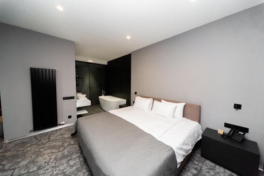 Postel nebo postele na pokoji v ubytování SMALL HOTEL