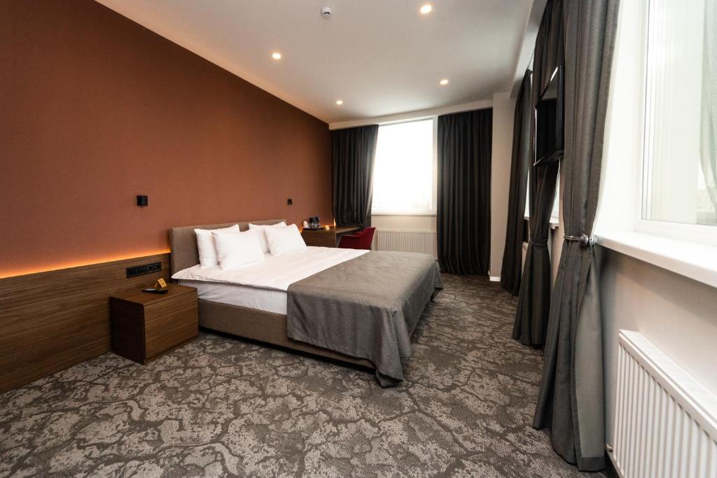 Postel nebo postele na pokoji v ubytování SMALL HOTEL