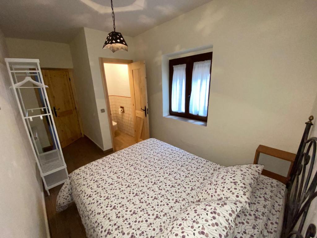 Postel nebo postele na pokoji v ubytování CASA DE VACACIONES EL NARANJO