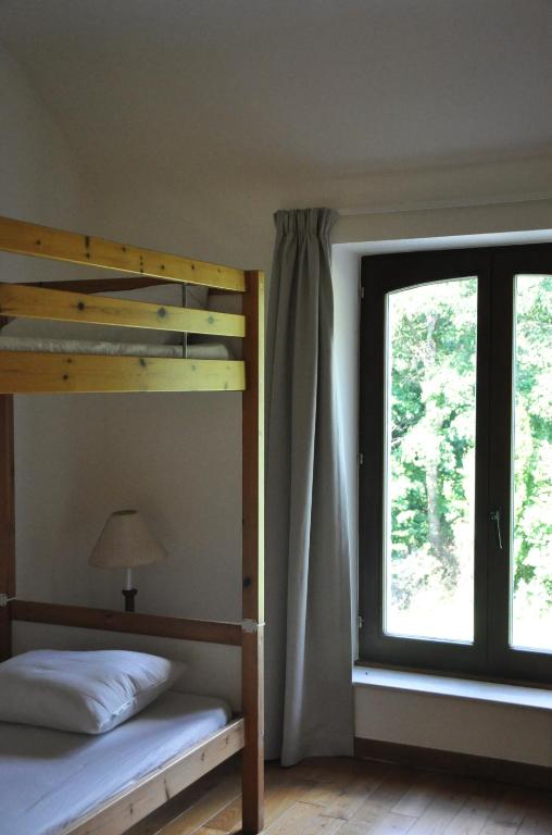 Postel nebo postele na pokoji v ubytování Petit château de Beauplateau
