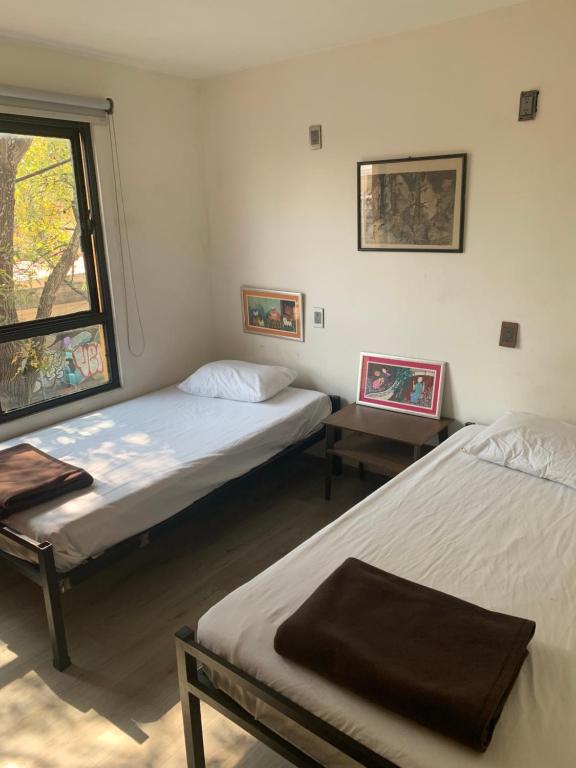 Postel nebo postele na pokoji v ubytování Hostal Hidalgo