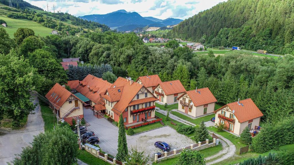 an aerial view of a large house in the mountains at Penzion pod Vlkolíncom in Ružomberok