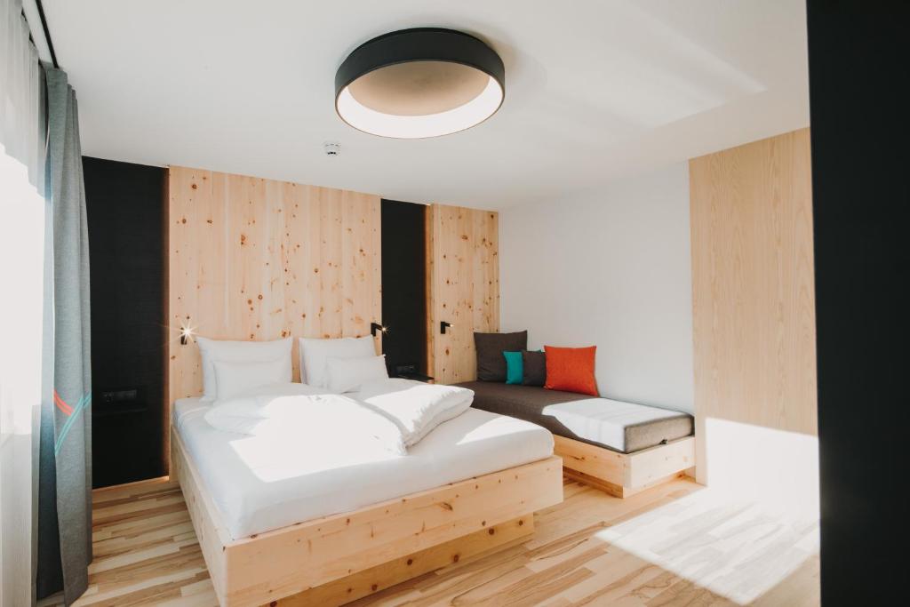 Posteľ alebo postele v izbe v ubytovaní Alpin - Studios & Suites