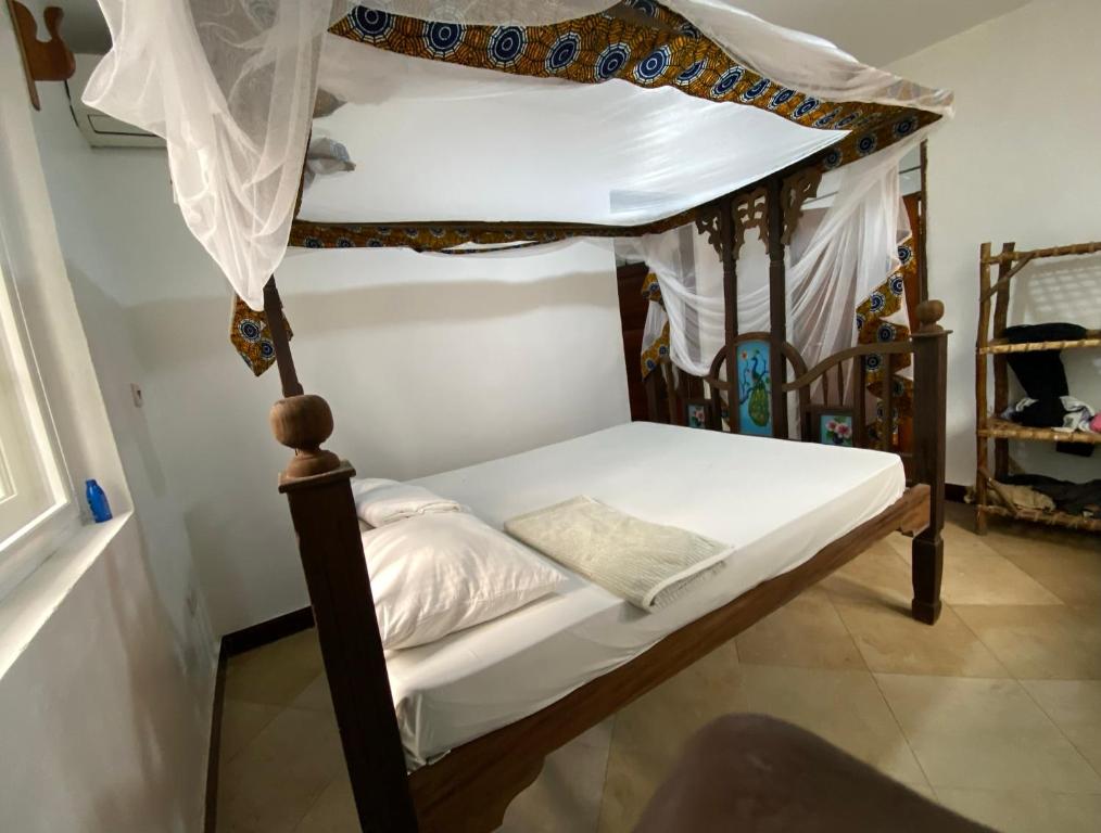 Postelja oz. postelje v sobi nastanitve Wimbi Cottage