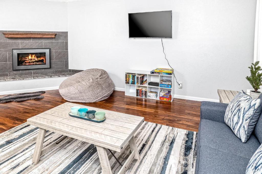 a living room with a couch and a coffee table at Midtown Anchorage Basecamp Condo B in Anchorage