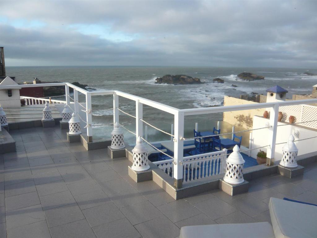 a balcony with a view of the ocean at La Fontaine Bleue in Essaouira