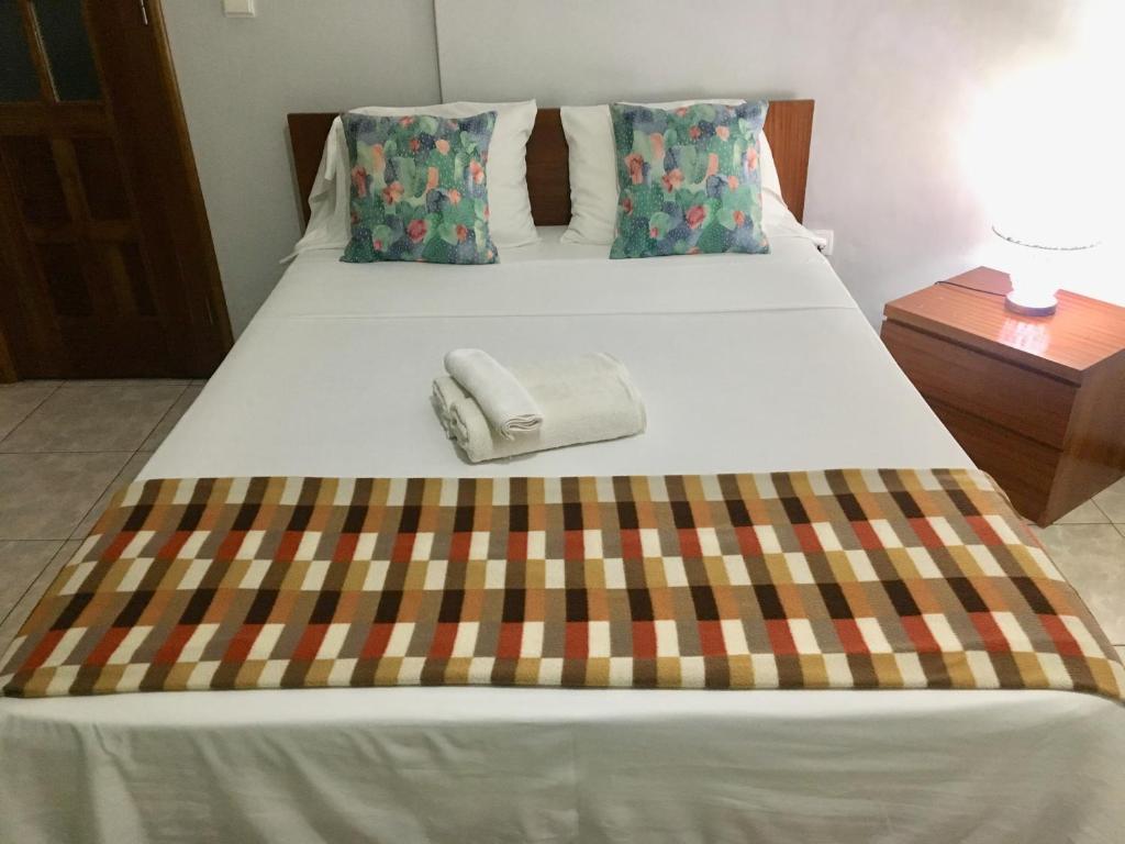 Postel nebo postele na pokoji v ubytování Laginha Beach Guest House