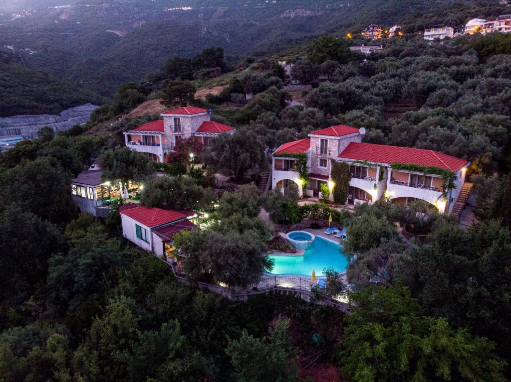 an aerial view of a house with a swimming pool at Resort "Maslinjak" in Budva