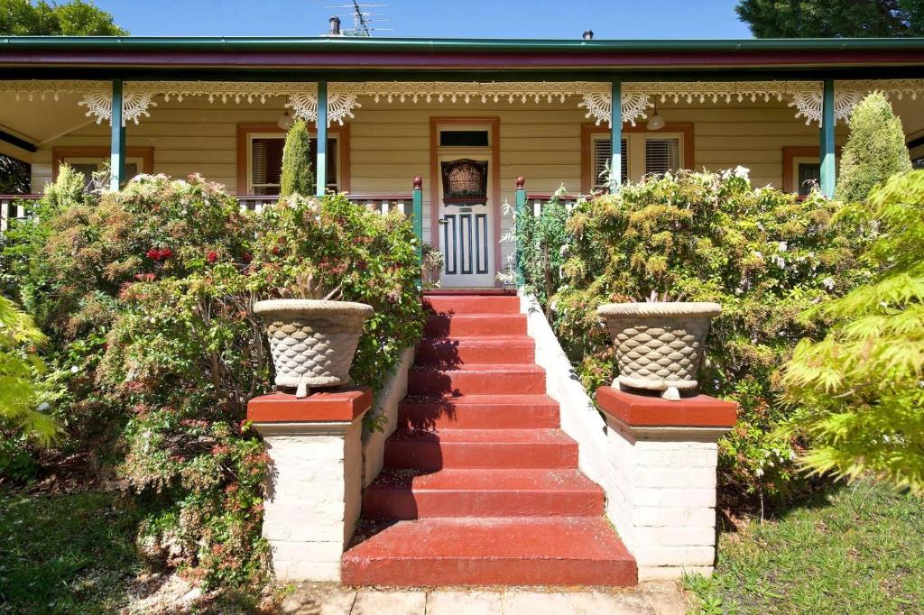 a house with a staircase leading to the front door at Mary Villa in Katoomba