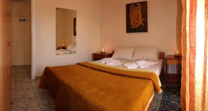 Postel nebo postele na pokoji v ubytování Agapi Apartments