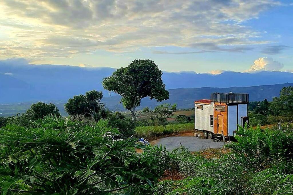 a view of a house with a view of a mountain at Mini Casa Barichara in Barichara