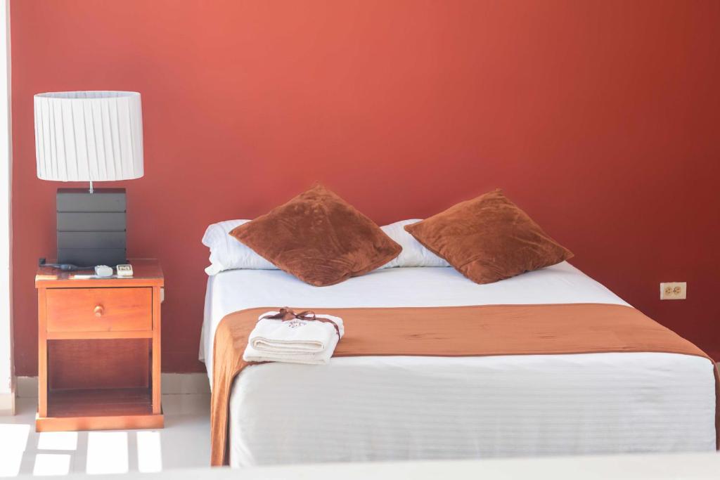 Postel nebo postele na pokoji v ubytování Zuruma Hotel