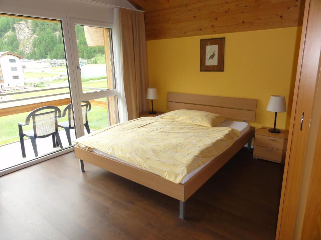Ein Bett oder Betten in einem Zimmer der Unterkunft Welcome Hotel Täsch by Täscherhof