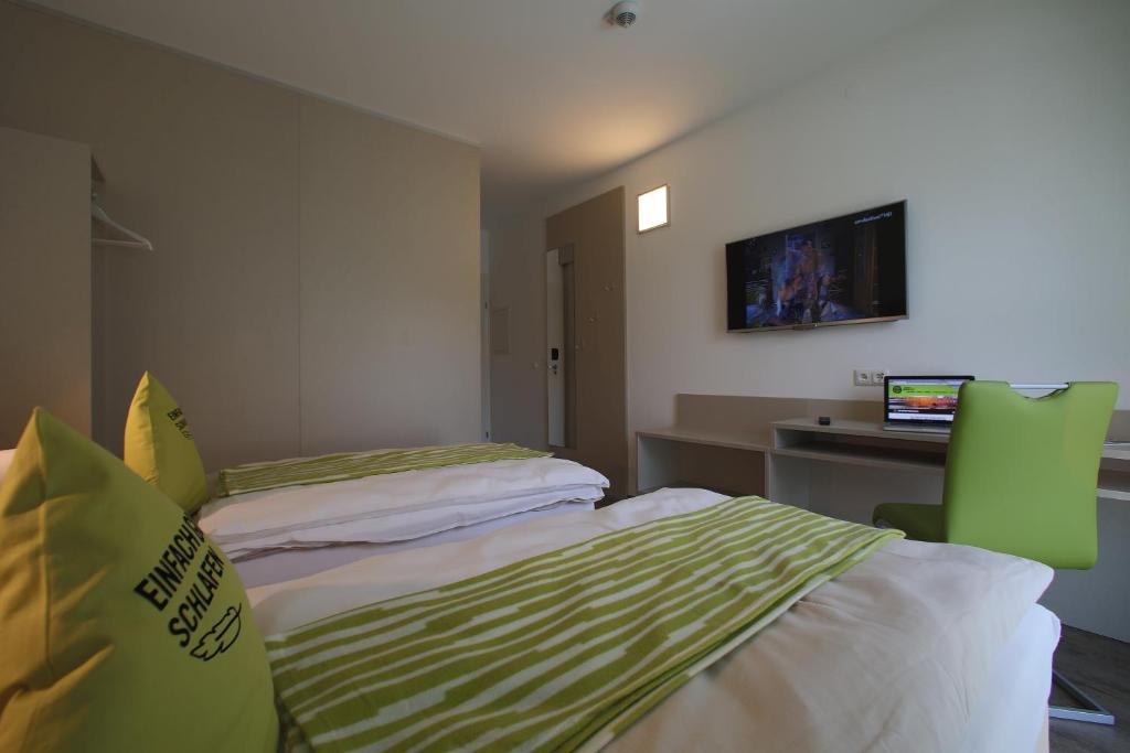 Postel nebo postele na pokoji v ubytování Smart Motel