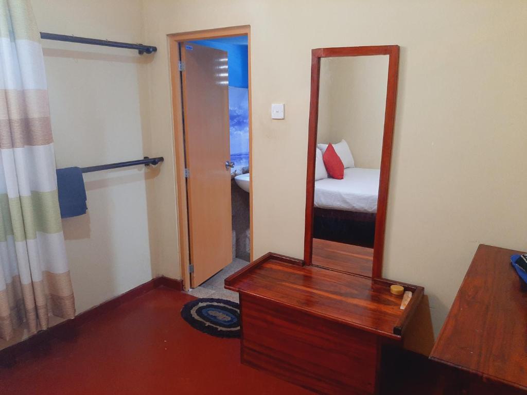 Postel nebo postele na pokoji v ubytování Kande Gedara Resort (කන්දෙ ගෙදර)