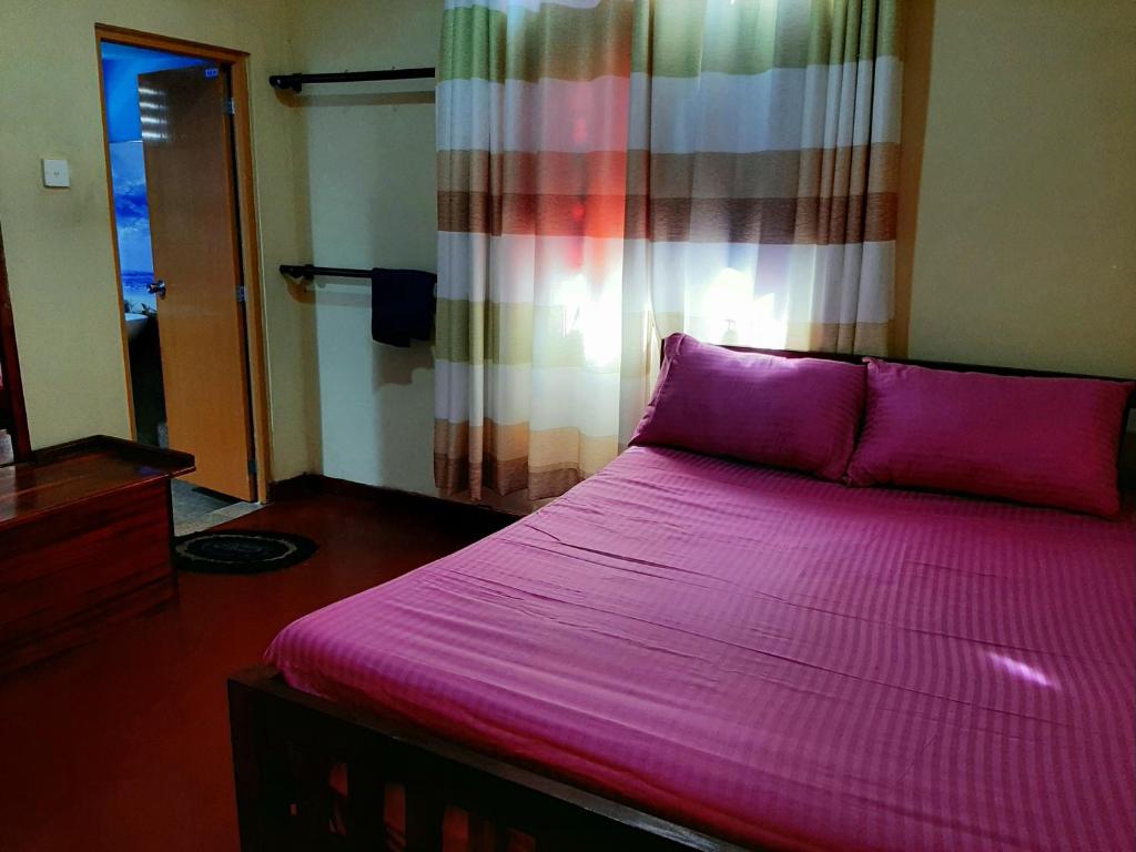 Postel nebo postele na pokoji v ubytování Kande Gedara Resort (කන්දෙ ගෙදර)