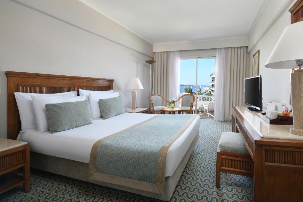 A bed or beds in a room at Iberotel Luxor