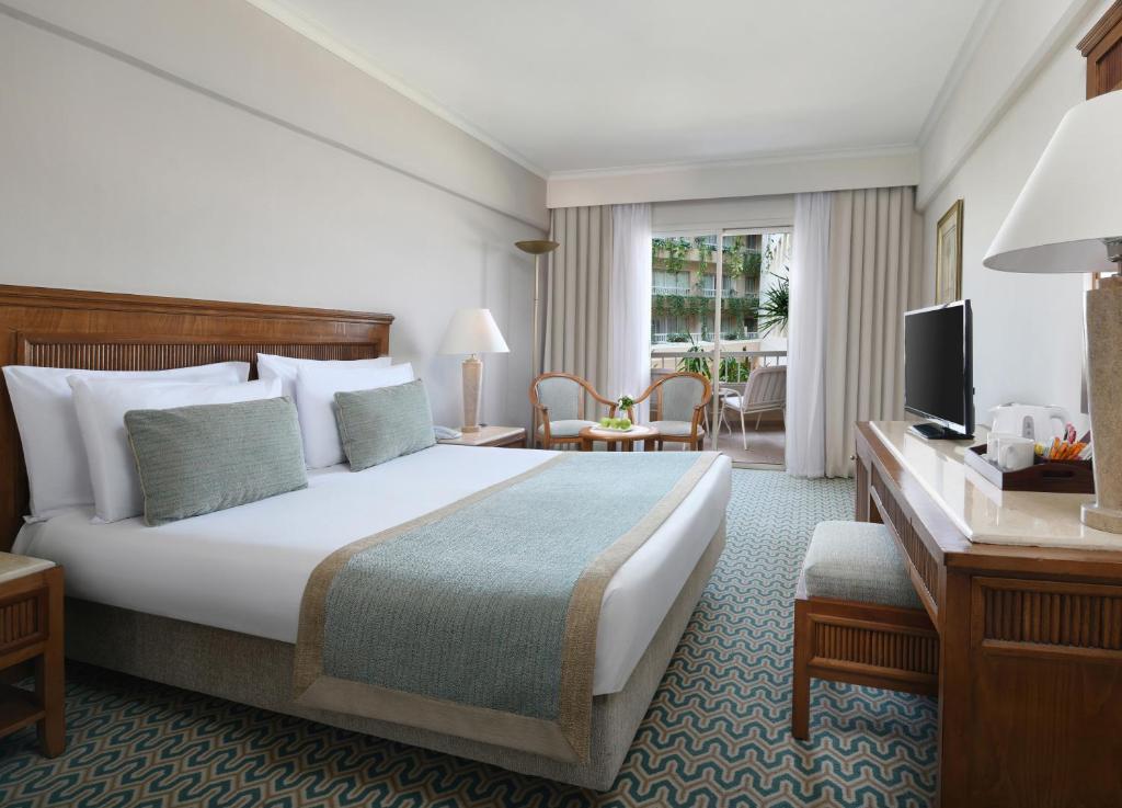 A bed or beds in a room at Iberotel Luxor