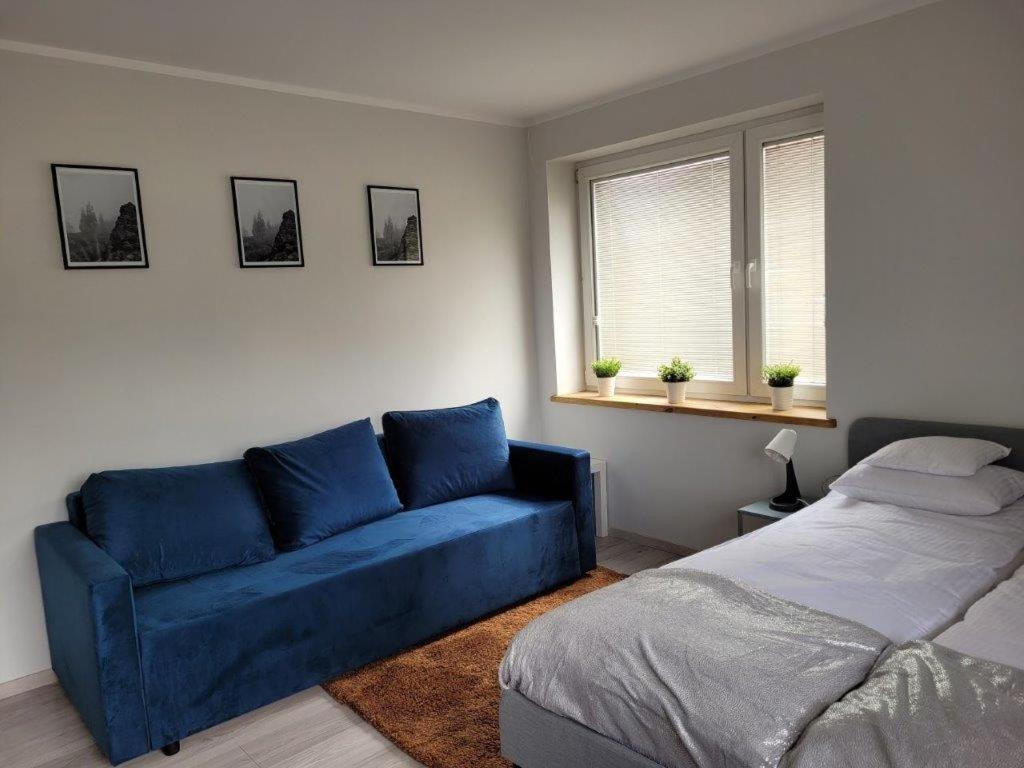 Posteľ alebo postele v izbe v ubytovaní Apartamenty Promyk Wisełka