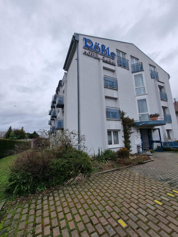 a building with a sign on the side of it at InTeck Hotel in Dettingen unter Teck