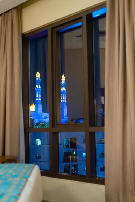 Postel nebo postele na pokoji v ubytování ROZANA HOTEL